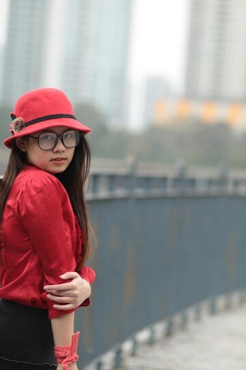 Natalia poses in a classy outfit on the bridge, Asian solo