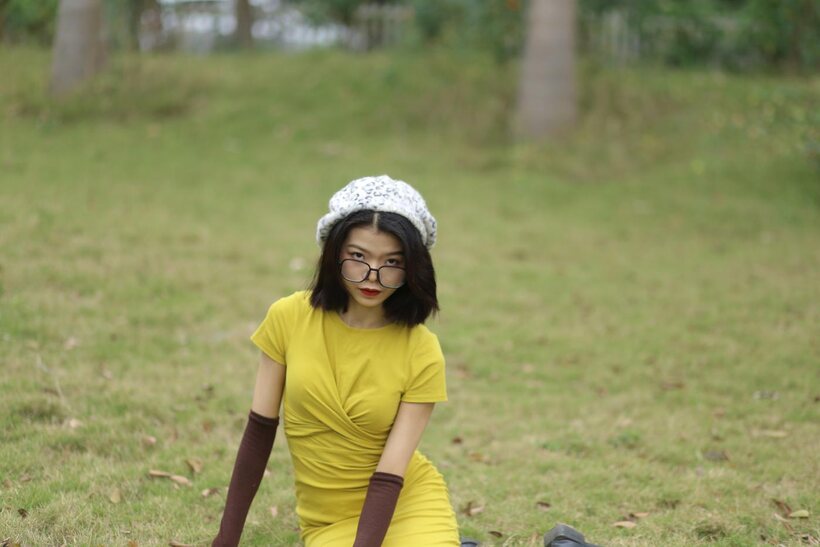 Asian nude photo 1 — Irena poses in a yellow dress and glasses, looking shy