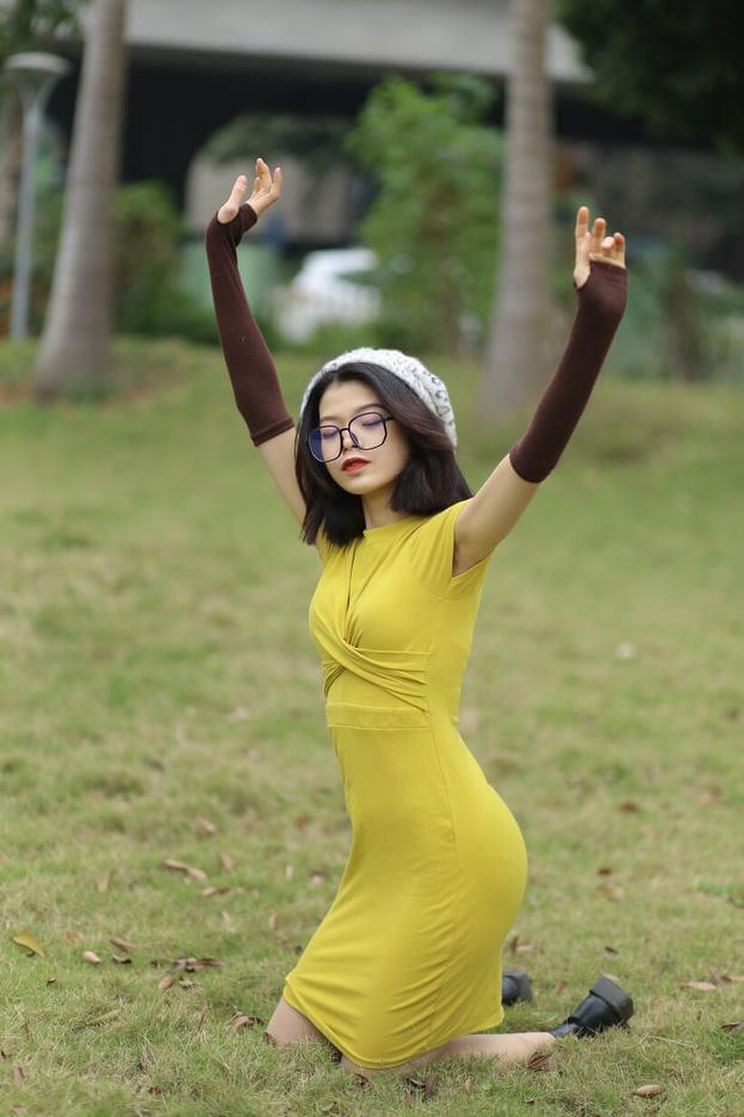 Asian pic 5 from the set «Irena poses in a yellow dress and glasses, looking shy»