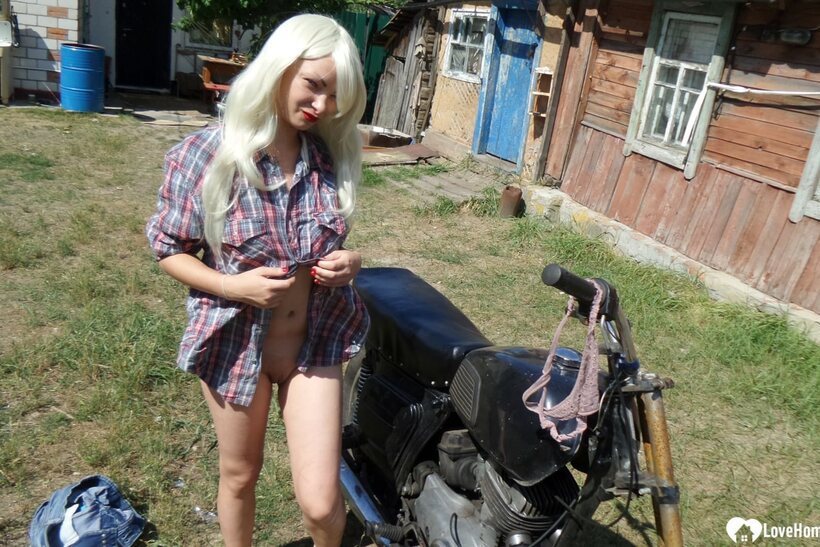 Amateur nude photo 9 — Blonde American poses on a motorbike, then strips to flash her booty