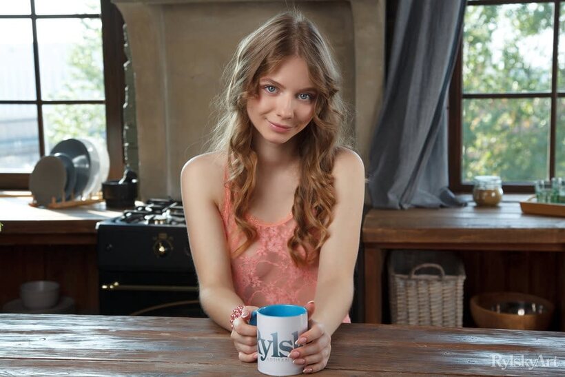 Beautiful pic 2 from the set «Naked on the kitchen table, Siya poses beside a cup of coffee»