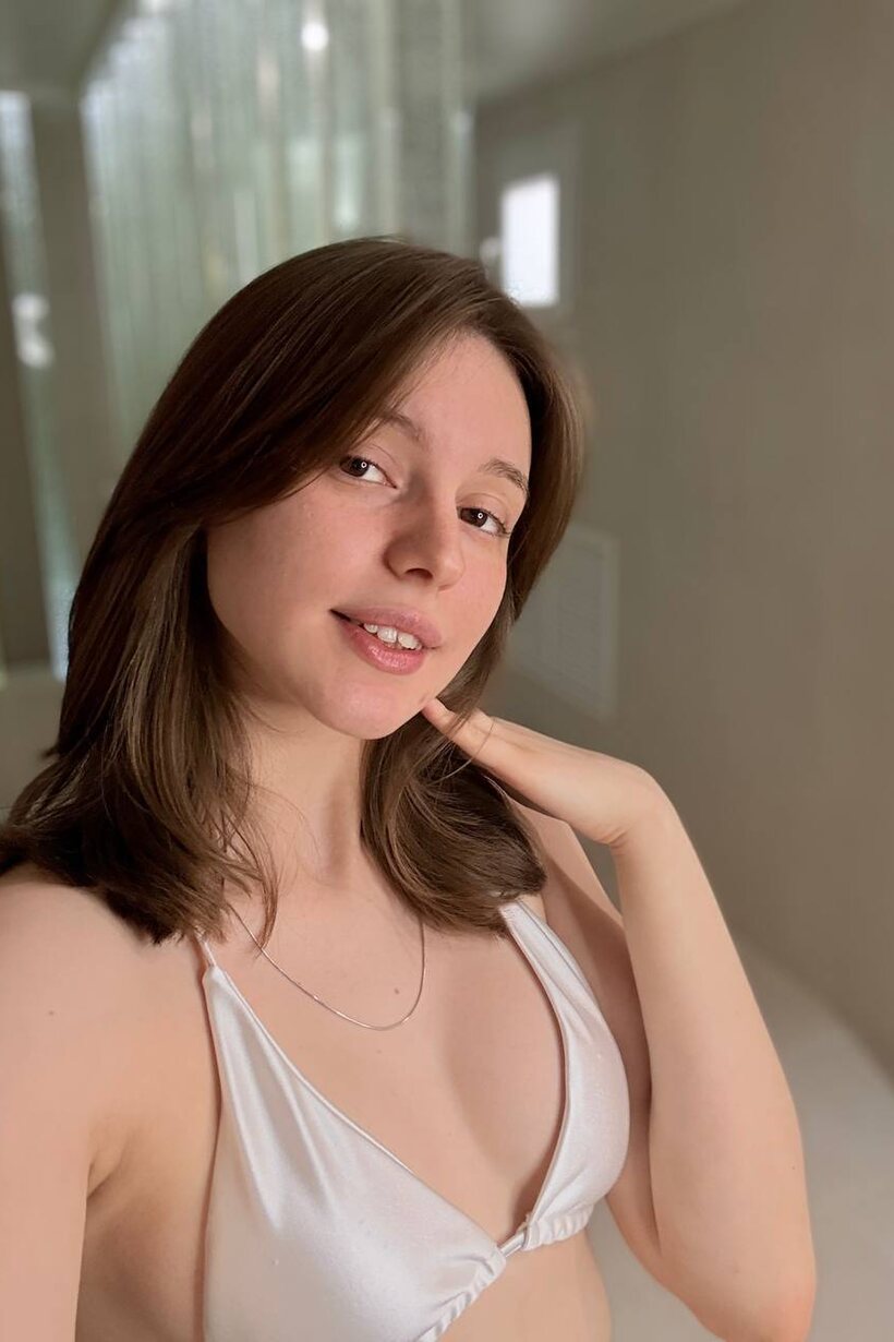 Image 15/15: Taking selfies in a sheer satin bikini, sexy solo girl poses