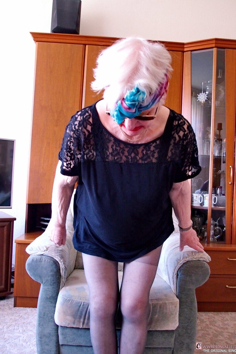 Nude blonde granny Grieselda puts her saggy tits on display (shot 1)