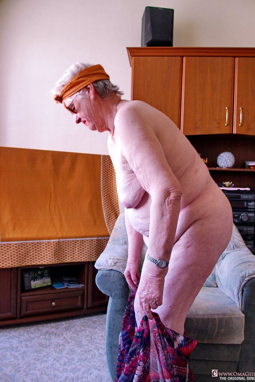 Nude blonde granny Grieselda puts her saggy tits on display (shot 8)