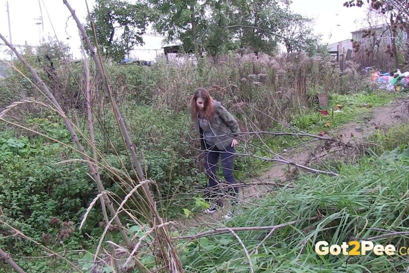 Image 4/15: Denisa spreads her legs and pisses along a dirt path