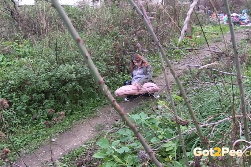 European pic 7 from the set «Denisa spreads her legs and pisses along a dirt path»
