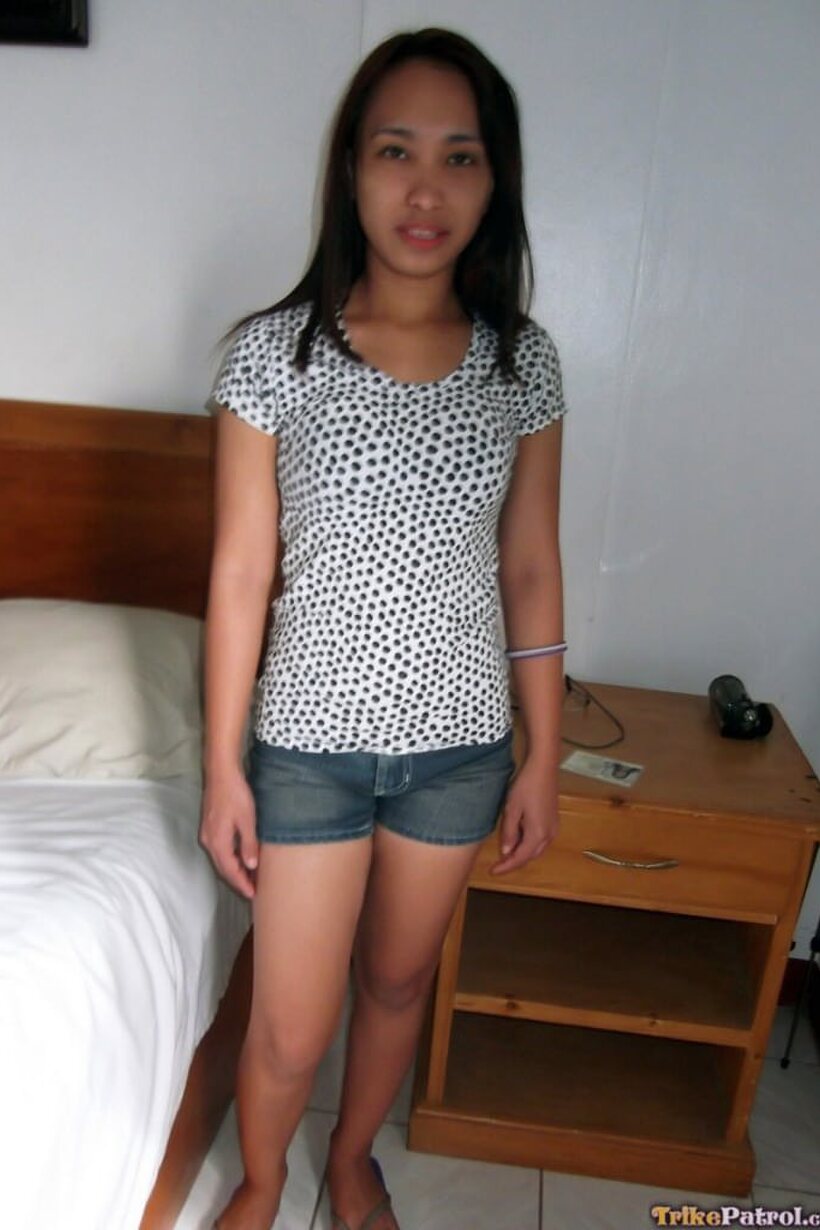 Photo 1 — Amateur girl exposes her tiny tits and nipples while undressing