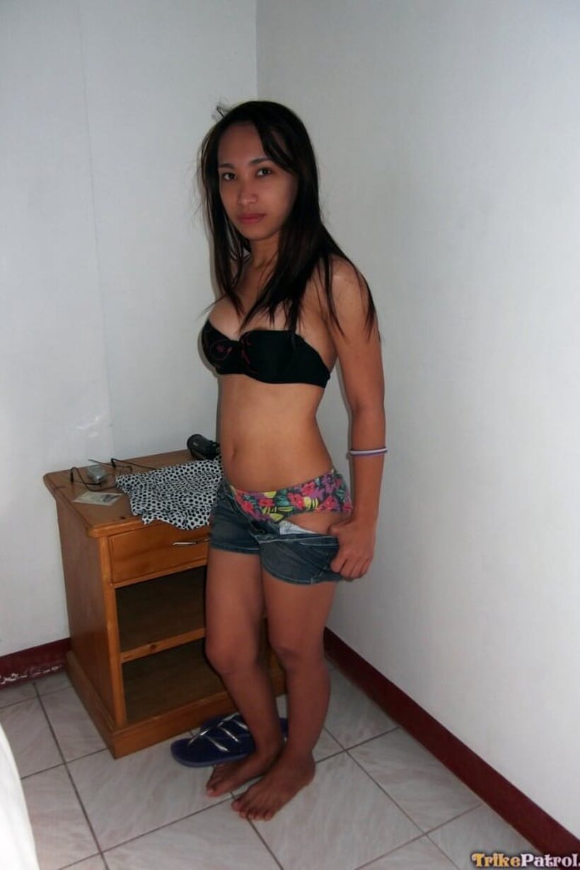 Photo 2 — Amateur girl exposes her tiny tits and nipples while undressing
