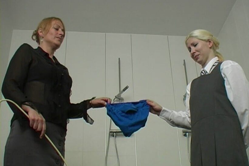 Photo 3 — Forced naked, the blonde student takes a brutal caning in the shower