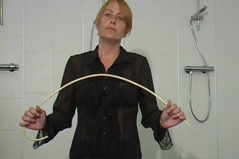 Photo 9 — Forced naked, the blonde student takes a brutal caning in the shower