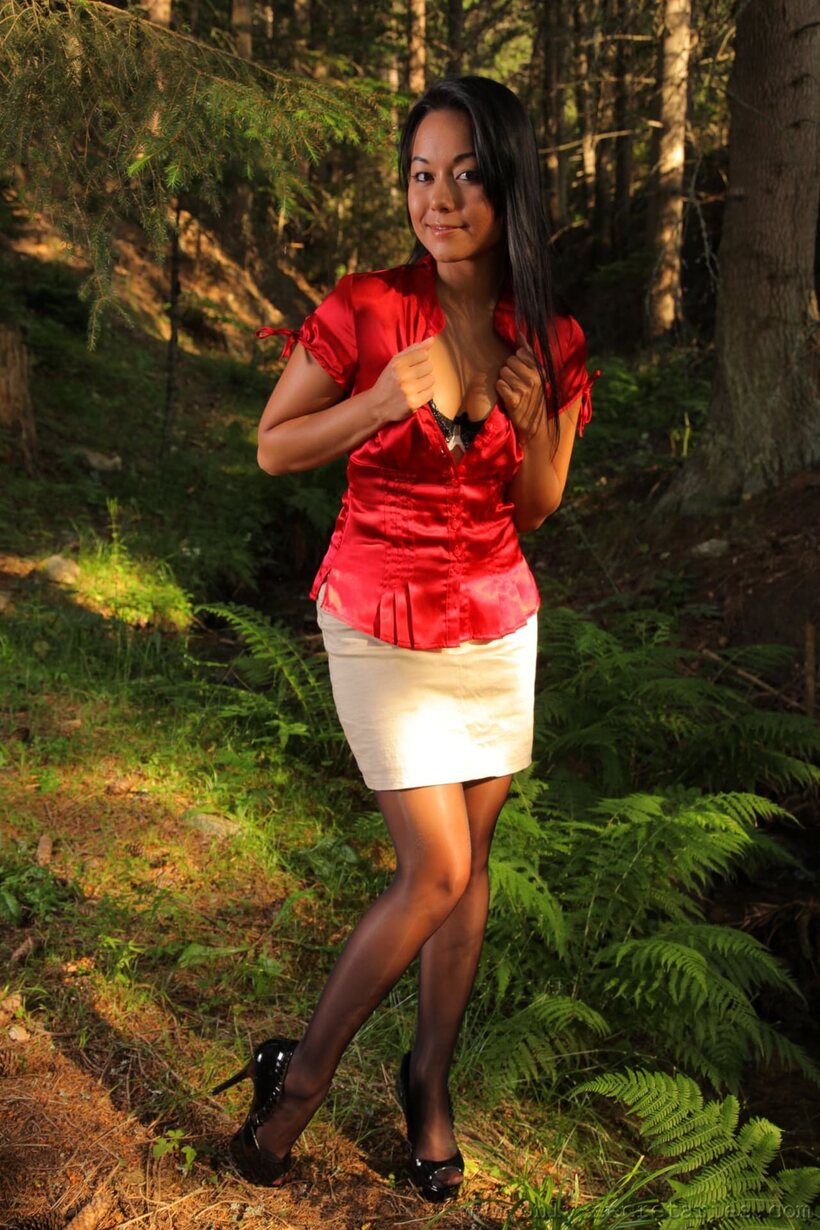 Photo 7 — Lily S shows off her small body in a lacy garter belt outdoors