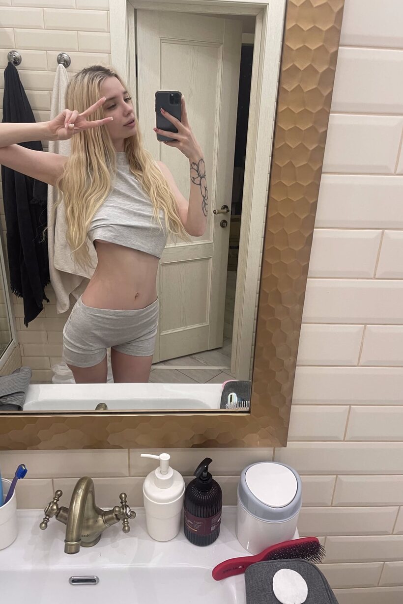 Photo 2 — Blonde girl taking selfies in glasses