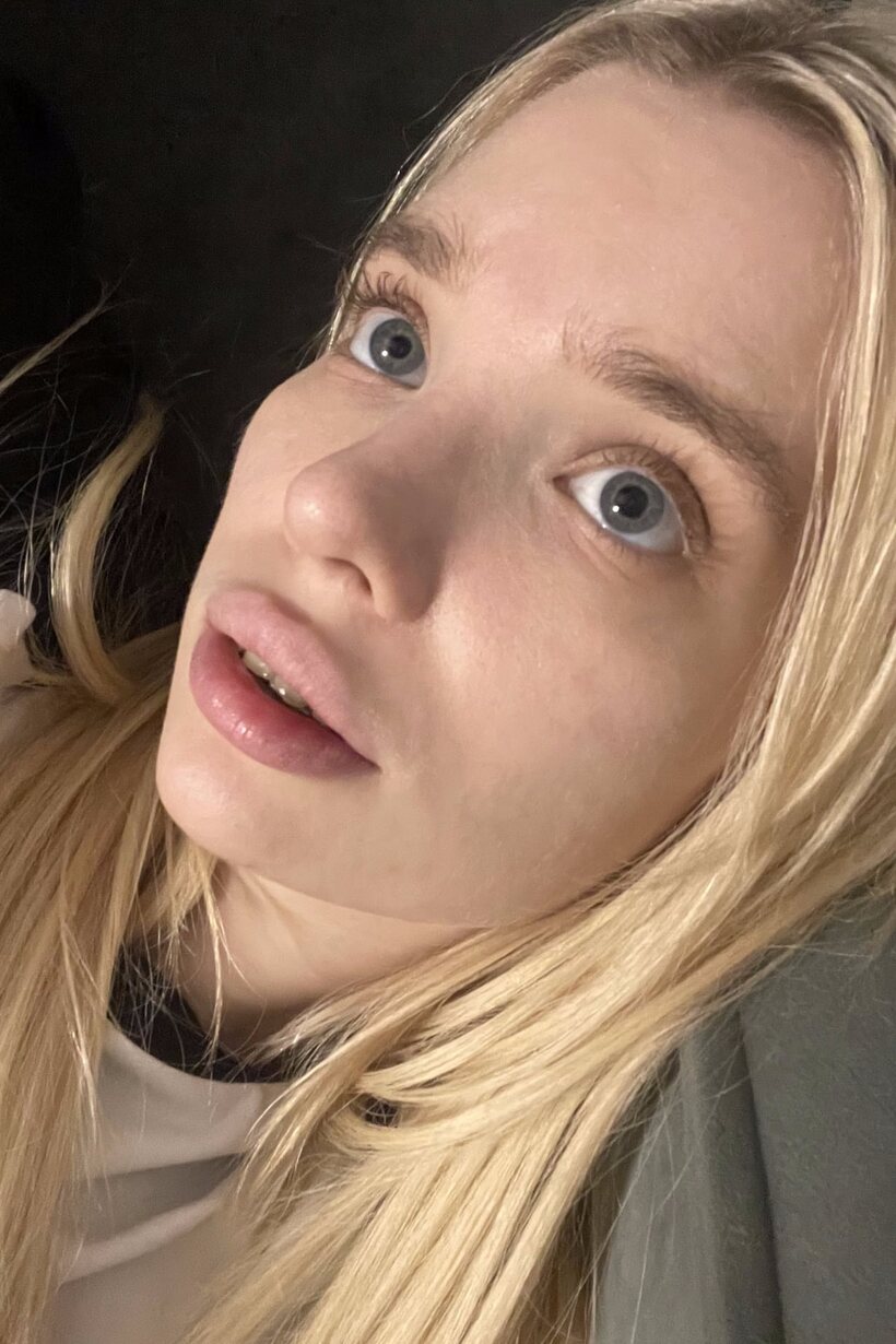 Blonde girl taking selfies in glasses (shot 8)