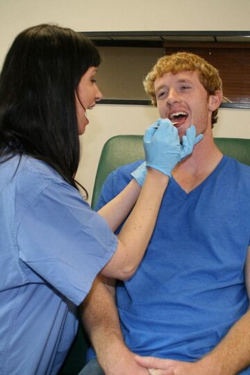 Angie Noir gives her horny patient a sweet blowjob as nurse