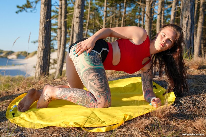 Photo 5 — Tattooed amateur shares a woods picnic with her man friend