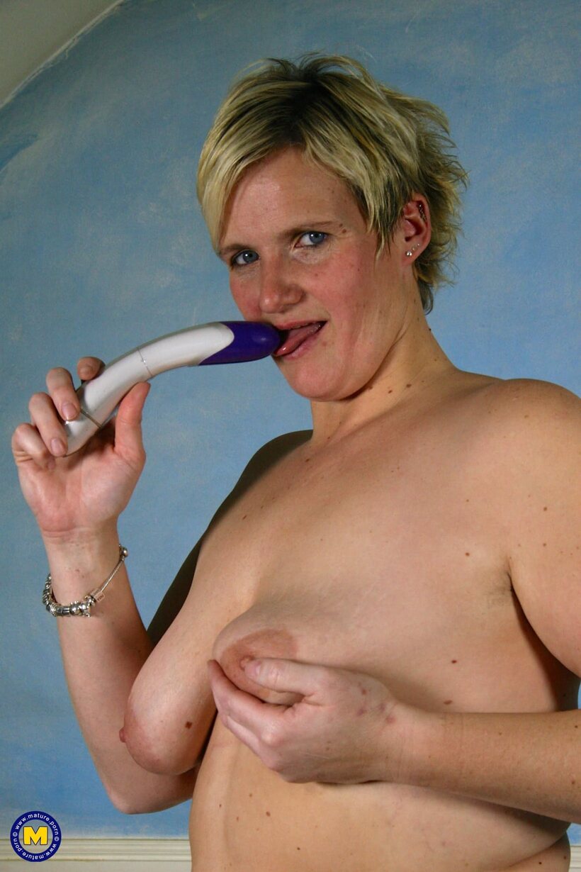 Photo 16 — Dutch girl flaunts her tiny tits and nipples while playing with a dildo