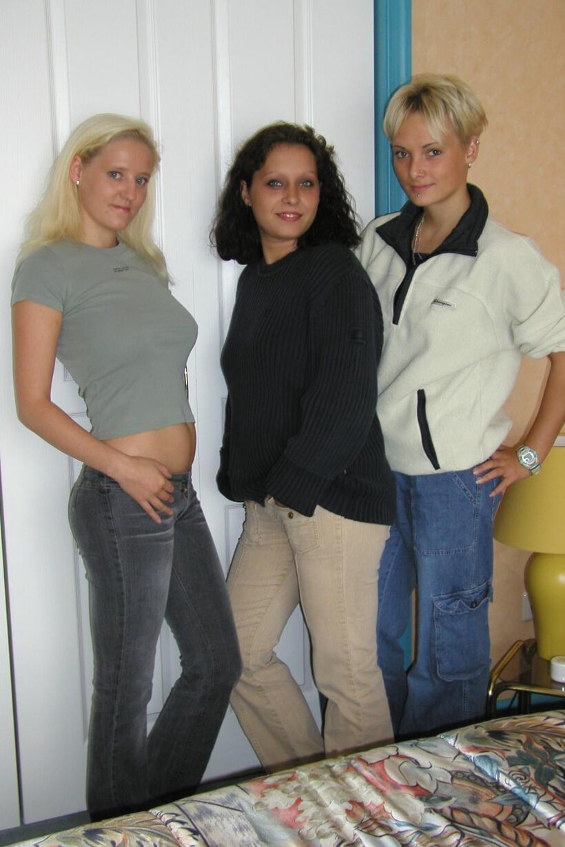 Clothed girl shows her big tits and nipples in a threesome, photo 1 of 21