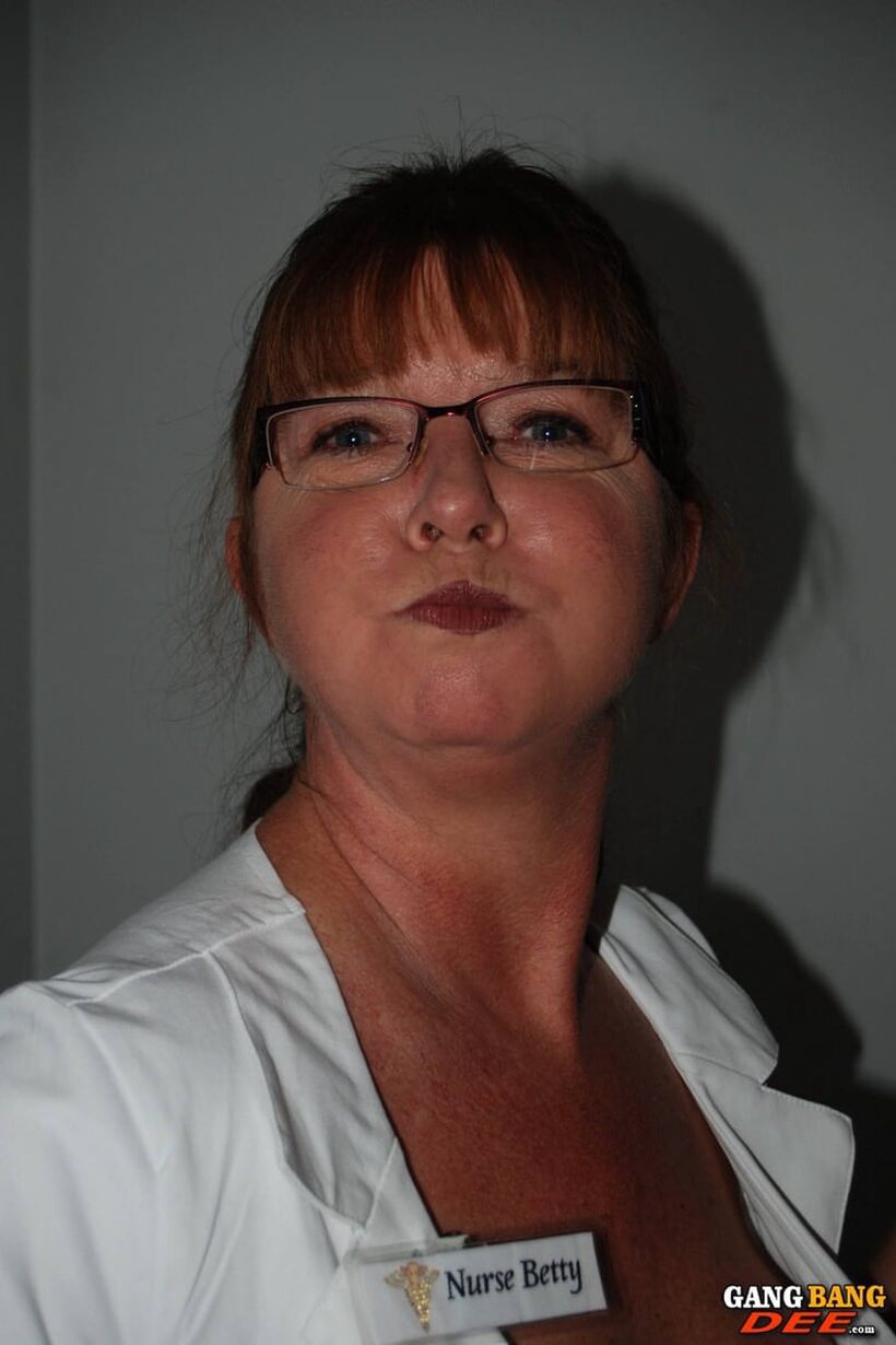 Photo 20 — In glasses, Dee Delmar in a nurse uniform gives a hot handjob