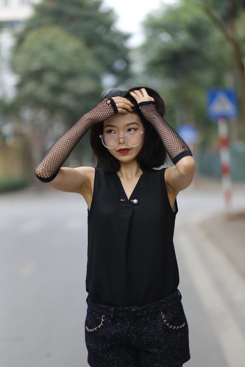 Image 15/21: Asian girl exposes her body outdoors