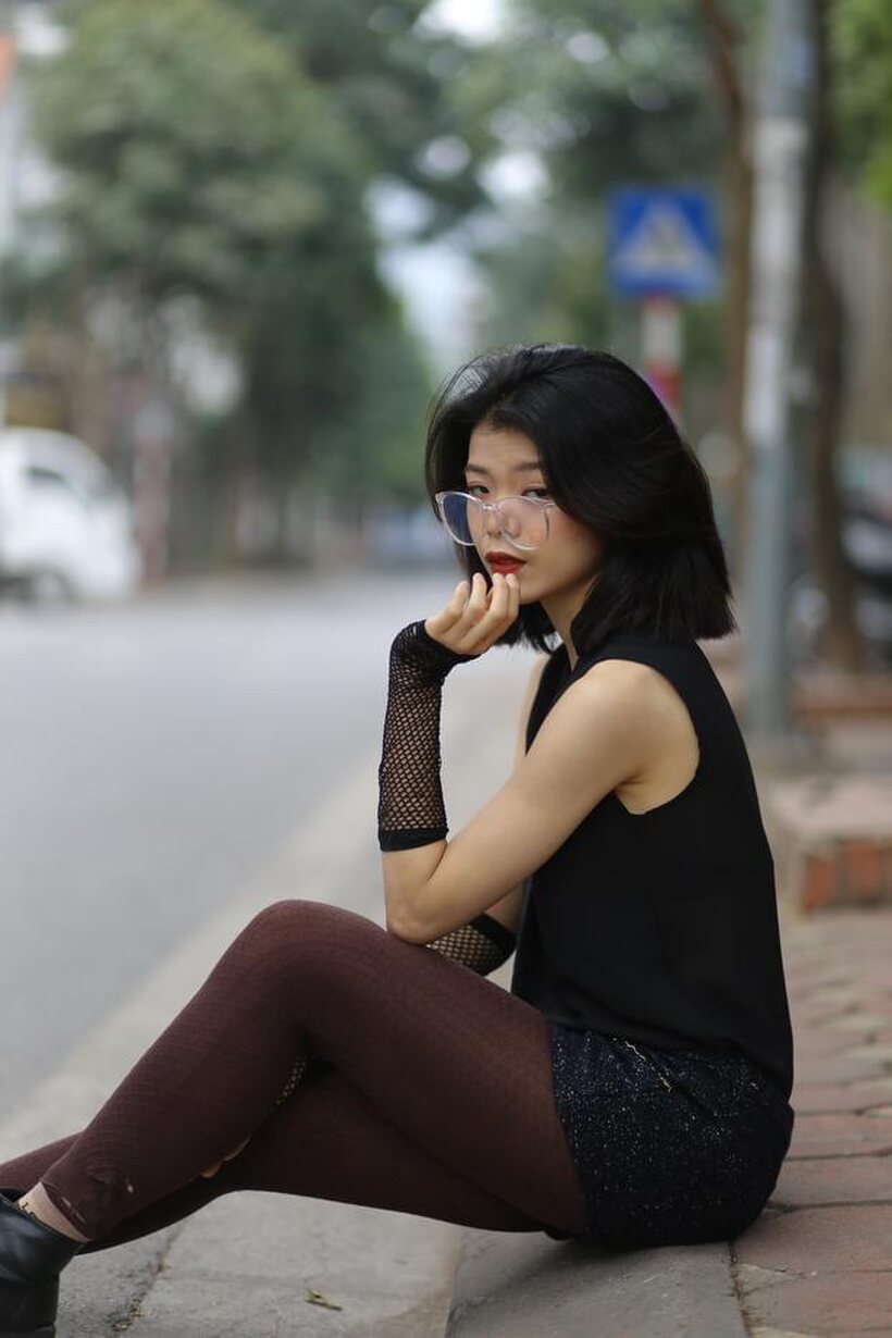 Image 21/21: Asian girl exposes her body outdoors