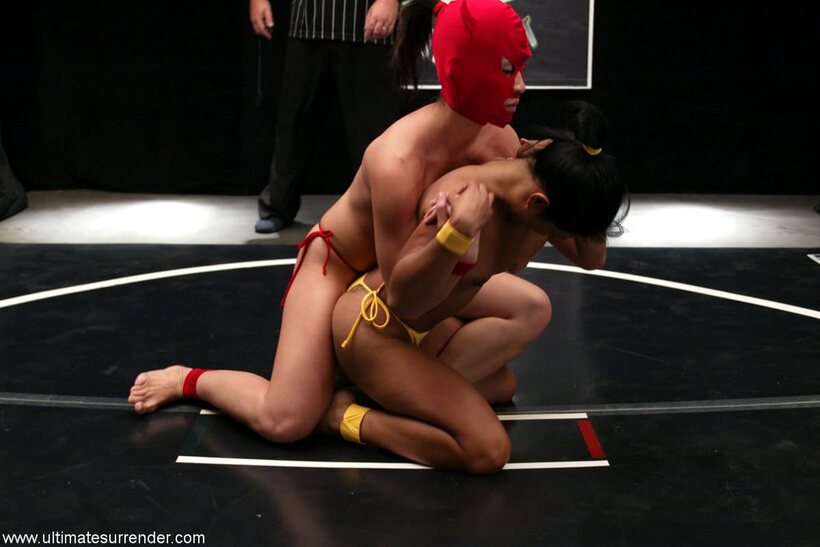 Lyla Lei and Crimson Ninja warm up for a topless wrestling bout (shot 14)