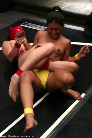 Lyla Lei and Crimson Ninja warm up for a topless wrestling bout