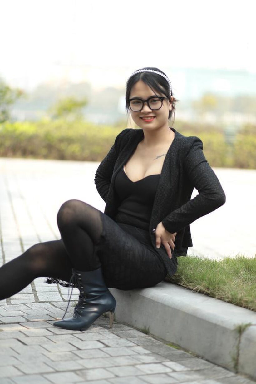 Image 14/21: Posing outdoors in a hot black outfit, curvy Asian girl with glasses