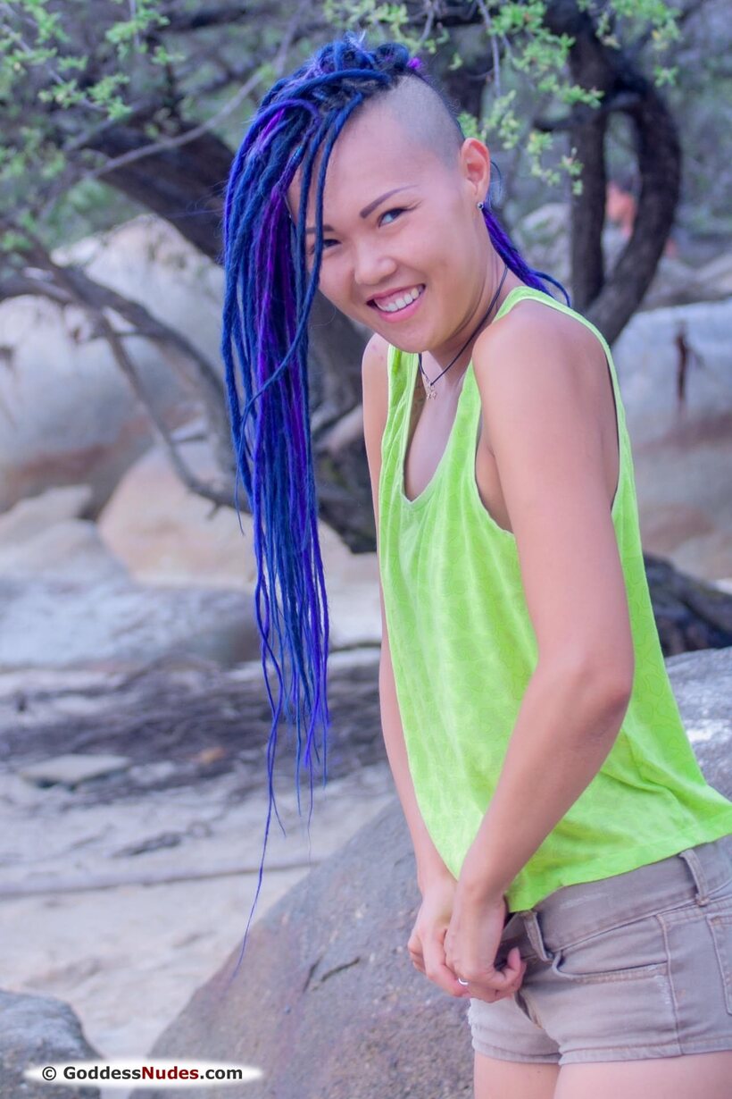 Image 1/21: Sweet Julie gets naked on a blue beach and shows her pussy