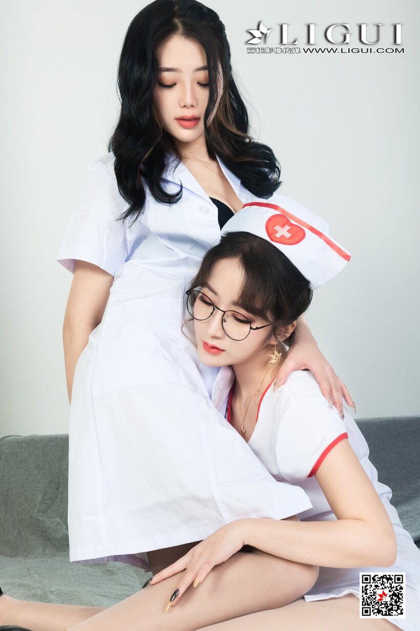 Asian nurses tease each other with lesbian foreplay in a clothed scene, photo 6 of 10
