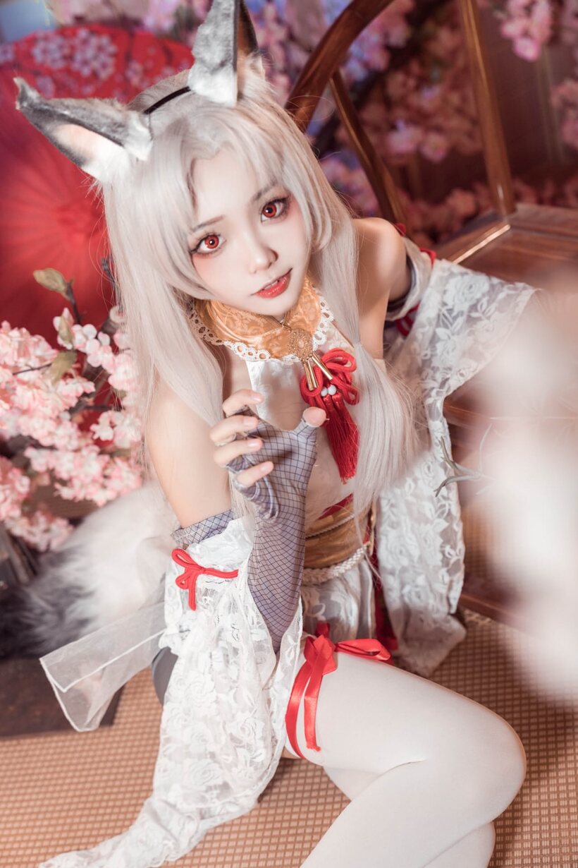 Platinum blonde Asian girl poses outdoors in cosplay lingerie, photo 4 of 10