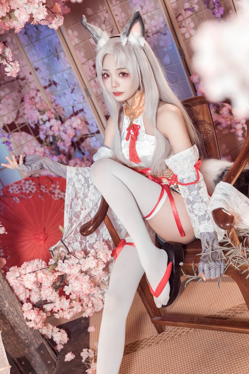 Image 6/10: Platinum blonde Asian girl poses outdoors in cosplay lingerie