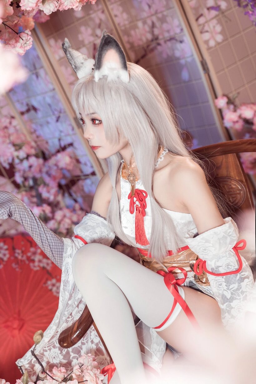 Platinum blonde Asian girl poses outdoors in cosplay lingerie (shot 8)
