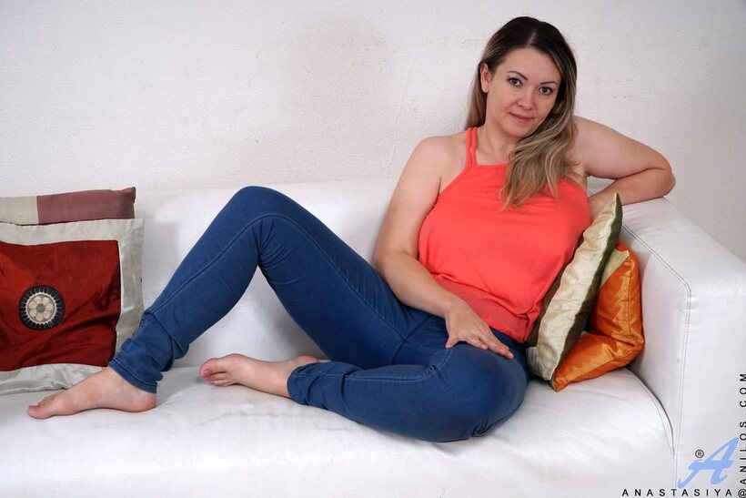 Image 1/16: MILF flaunts her big tits and pussy while undressing