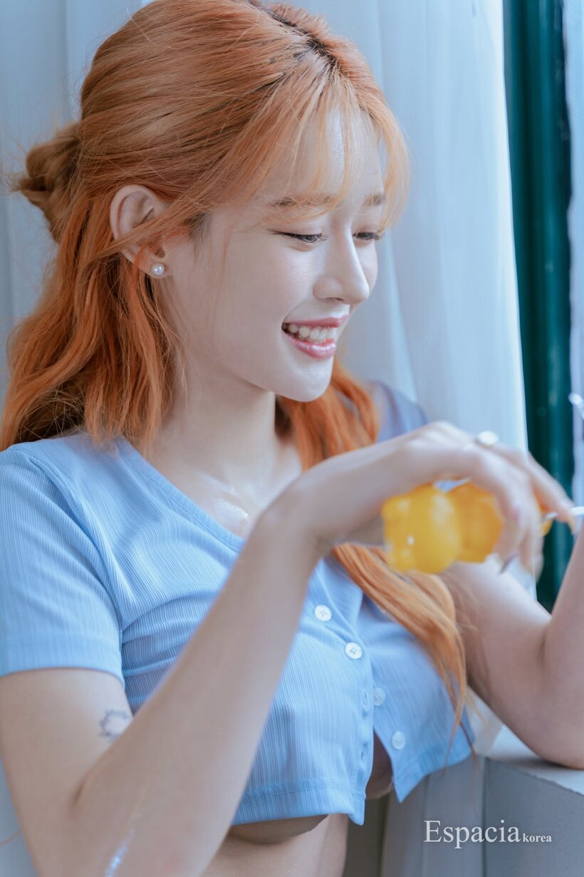 Asian pic 11 from the set «Orange-haired Korean babe showcases her fake tits and round ass solo»