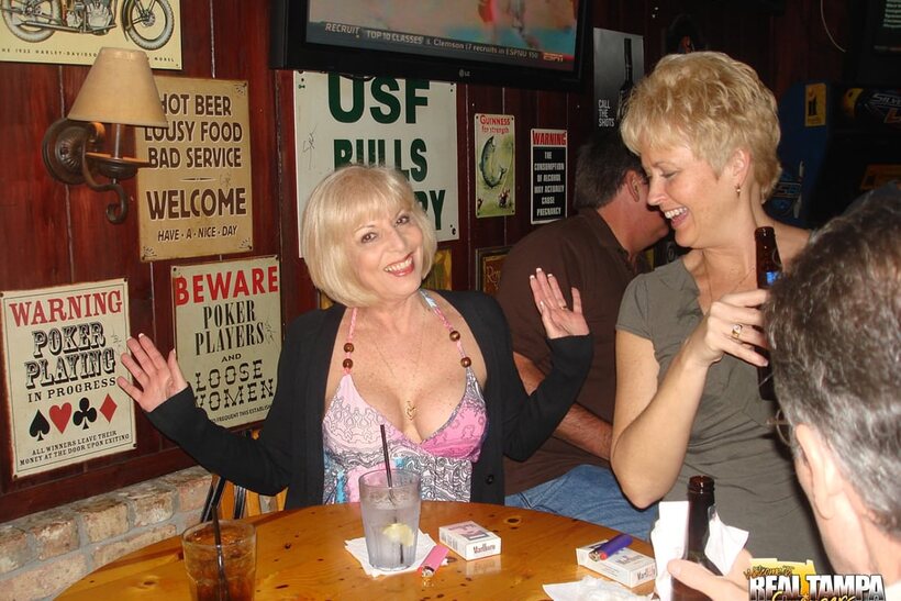 Photo 4 — Mature Dee Delmar plays with a dildo and shows her big tits at a party with Tracy Lick