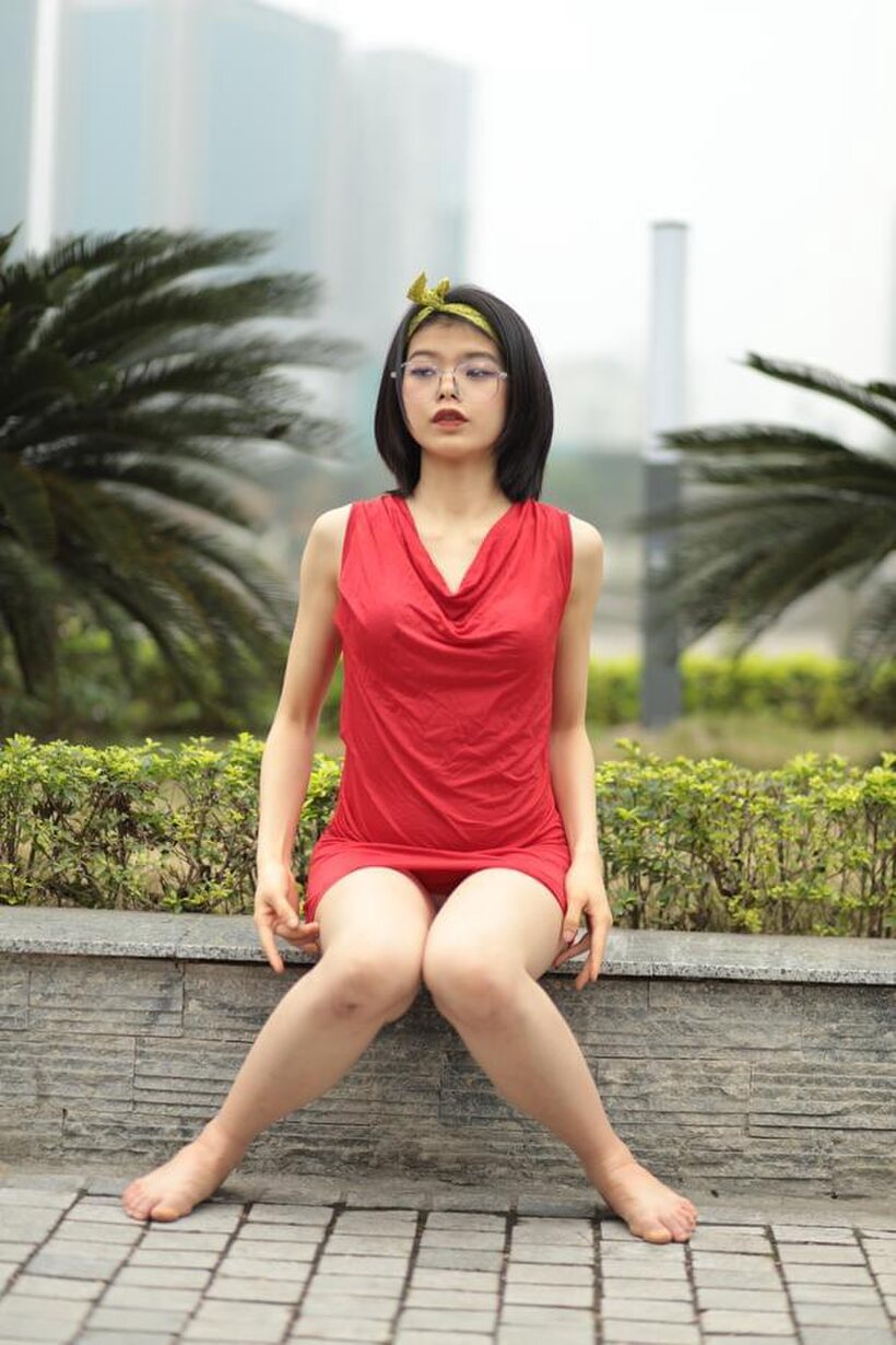 Photo 10 — Brunette girl strips out of her skirt and poses naked