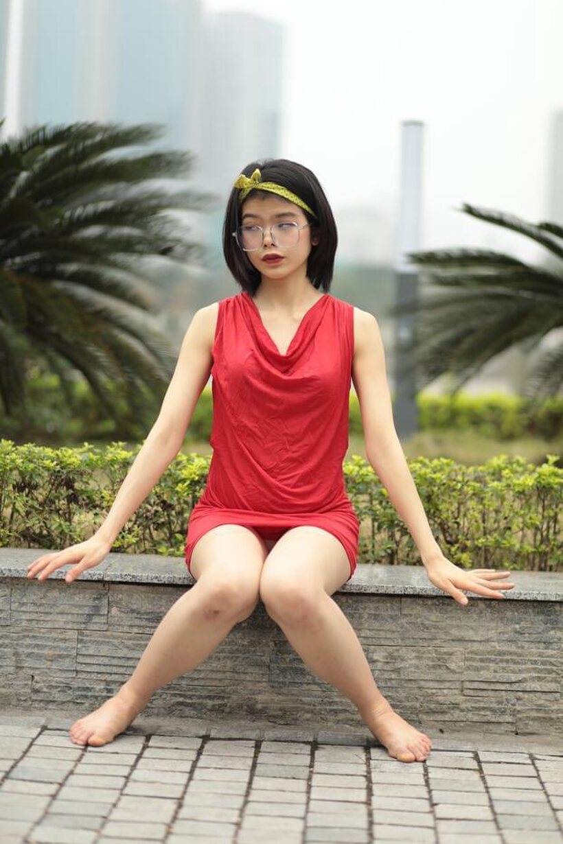 Photo 13 — Brunette girl strips out of her skirt and poses naked