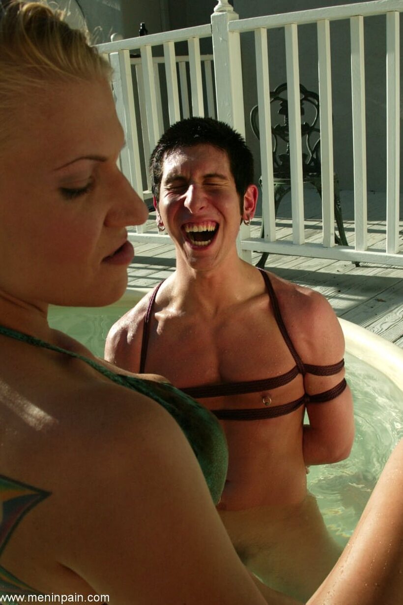 Image 19/21: In the hot tub, Mika Tan and Xana Star dominate a restrained male slave