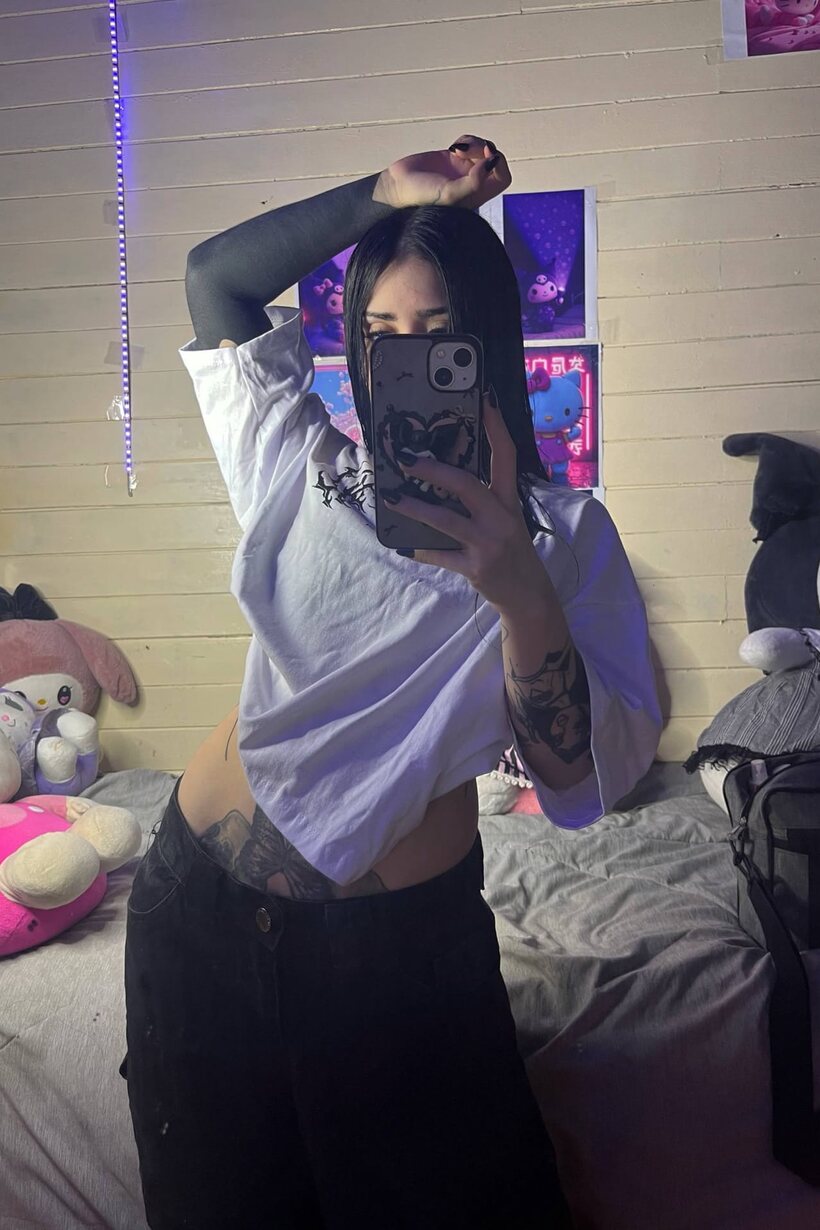 Tattooed Latina teen poses for mirror selfies, baring her flat stomach (shot 8)
