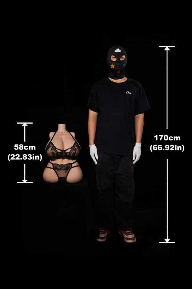 Sex Doll nude photo 1 — In a dark room, a fully clothed man cradles a naked sex doll