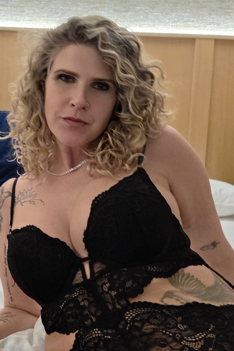 BBW pic 6 from the set «Curly-haired MILF models black lingerie while playing solo for the camera»