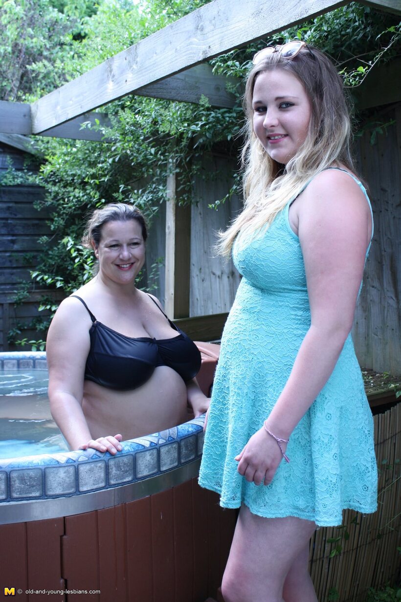 Curvy girl plays with a girlfriend and shows her big tits outdoors (shot 1)