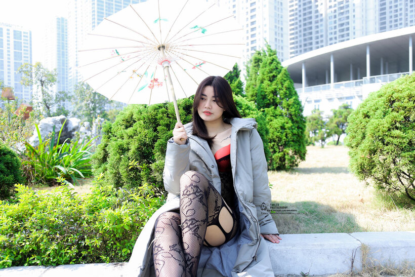 Image 2/21: Asian girl gets naked outdoors and shows her ass