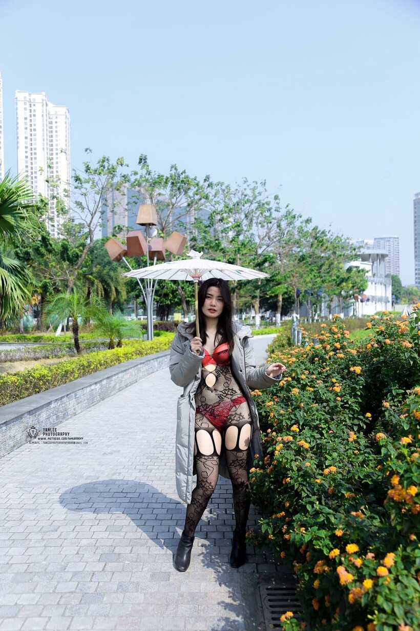 Photo 7 — Asian girl gets naked outdoors and shows her ass