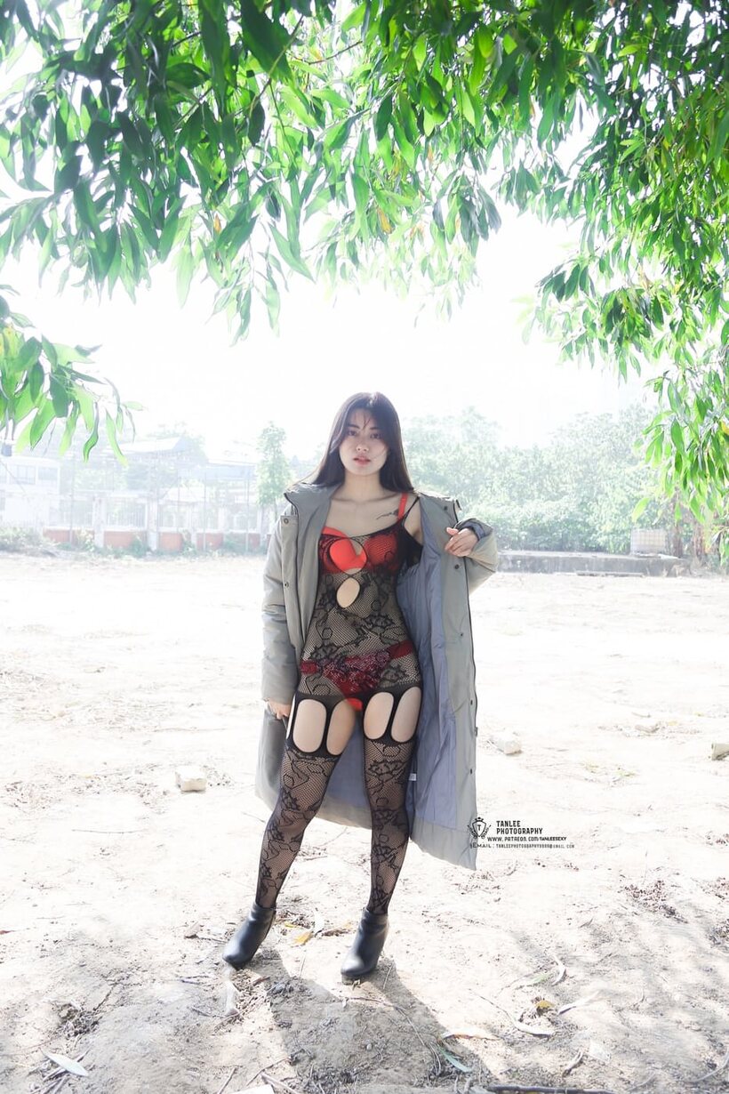 Asian girl gets naked outdoors and shows her ass (shot 14)