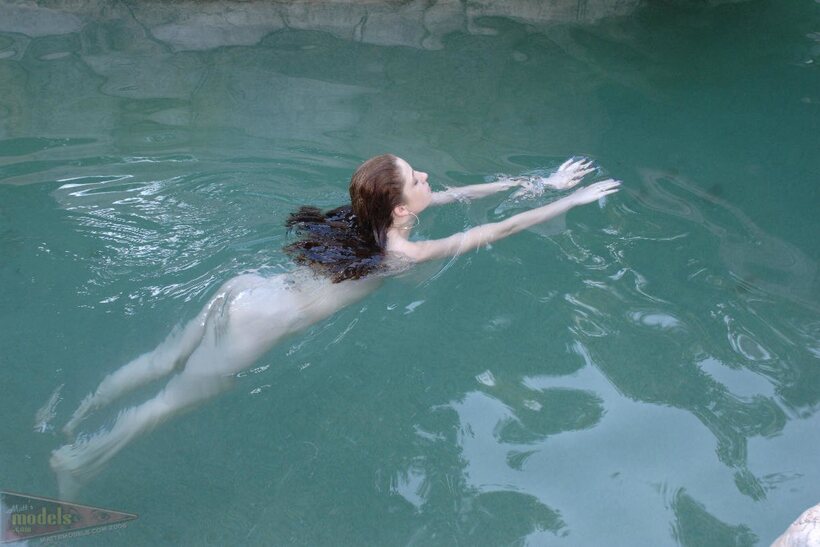 Image 15/16: Ruby Flame slips out of her bikini before going skinny dipping