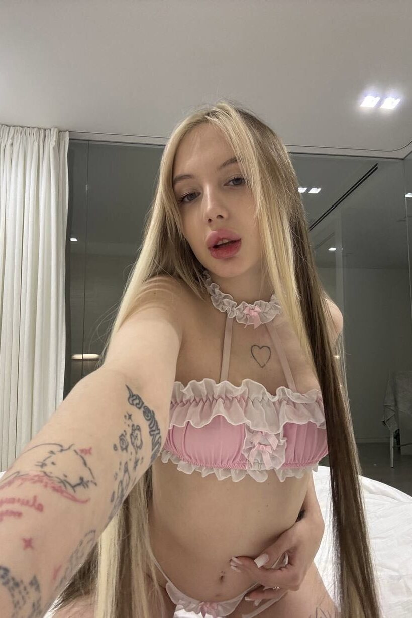 Photo 1 — Blonde teen Nikki Daniels teases solo in lingerie with a tattoo