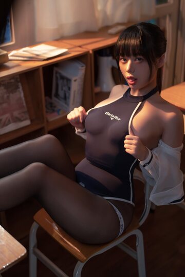 Big booty on display as a beautiful Asian babe models a bodysuit and pantyhose