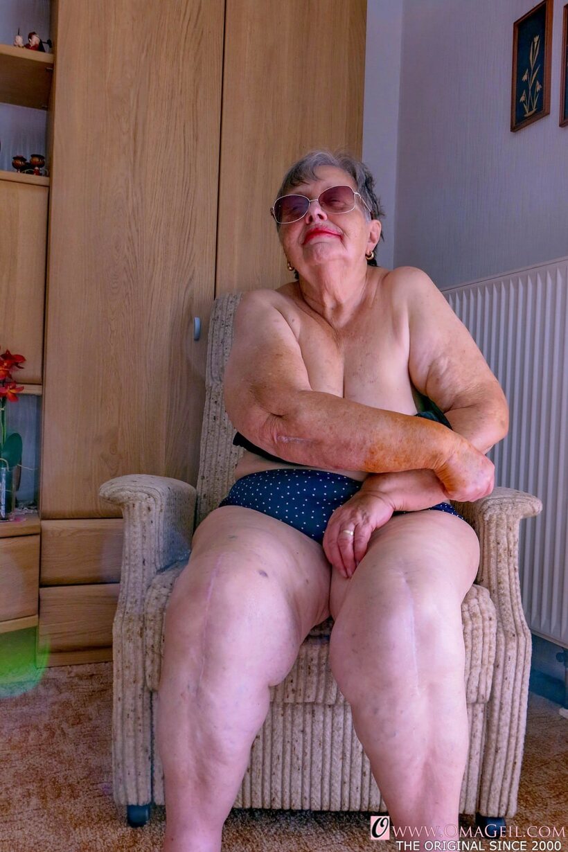 Obese granny gets naked, then covers her face with a towel (shot 5)
