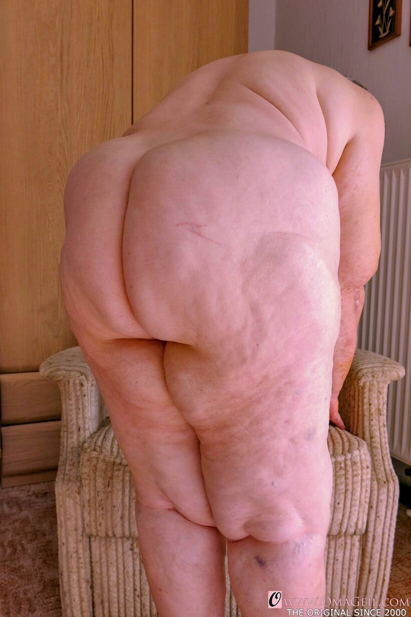 Obese granny gets naked, then covers her face with a towel (shot 13)